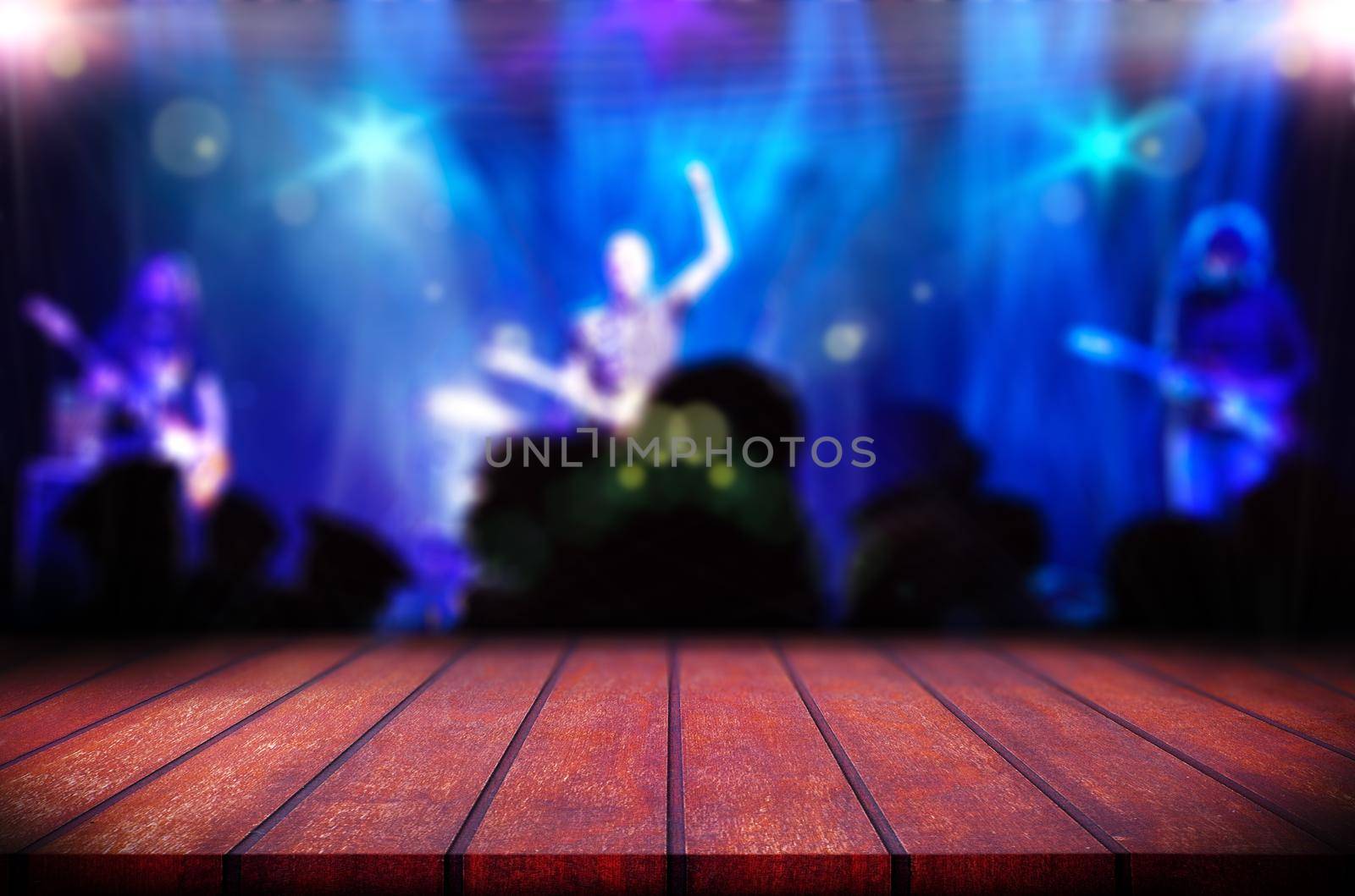 Abstract blurred background.Wooden table or counter and music band on stage