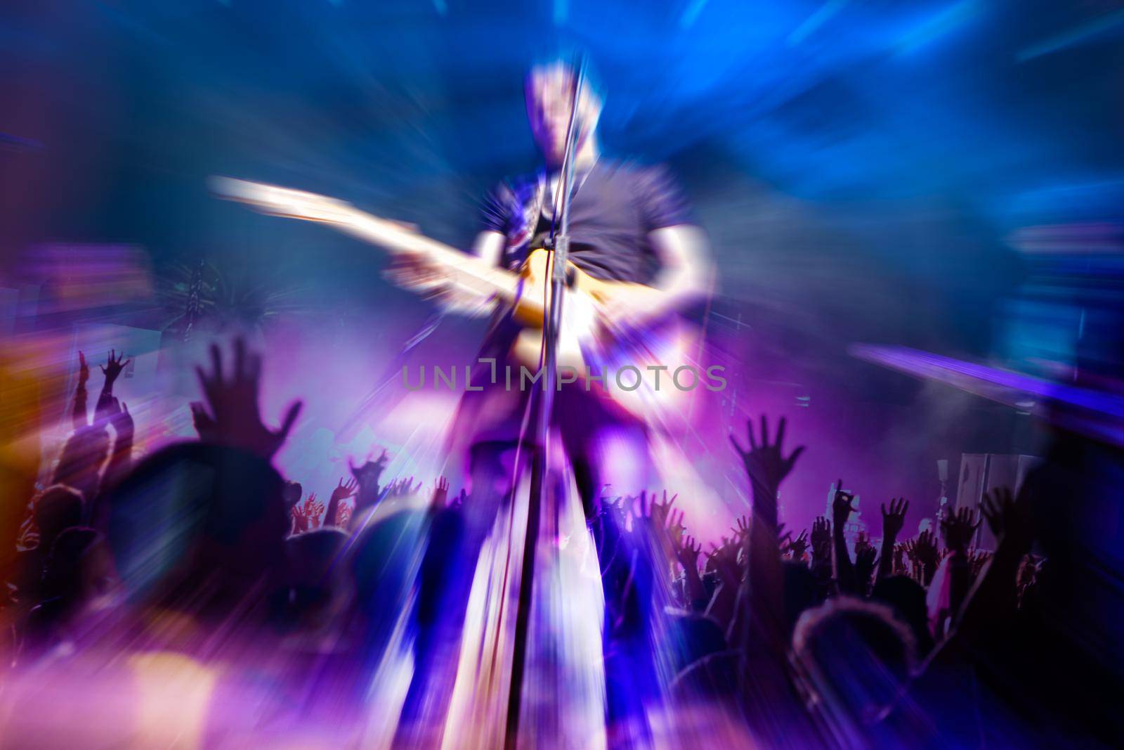 Man playing the guitar.Abstract Live music background concept.Guitar player and rock music concept