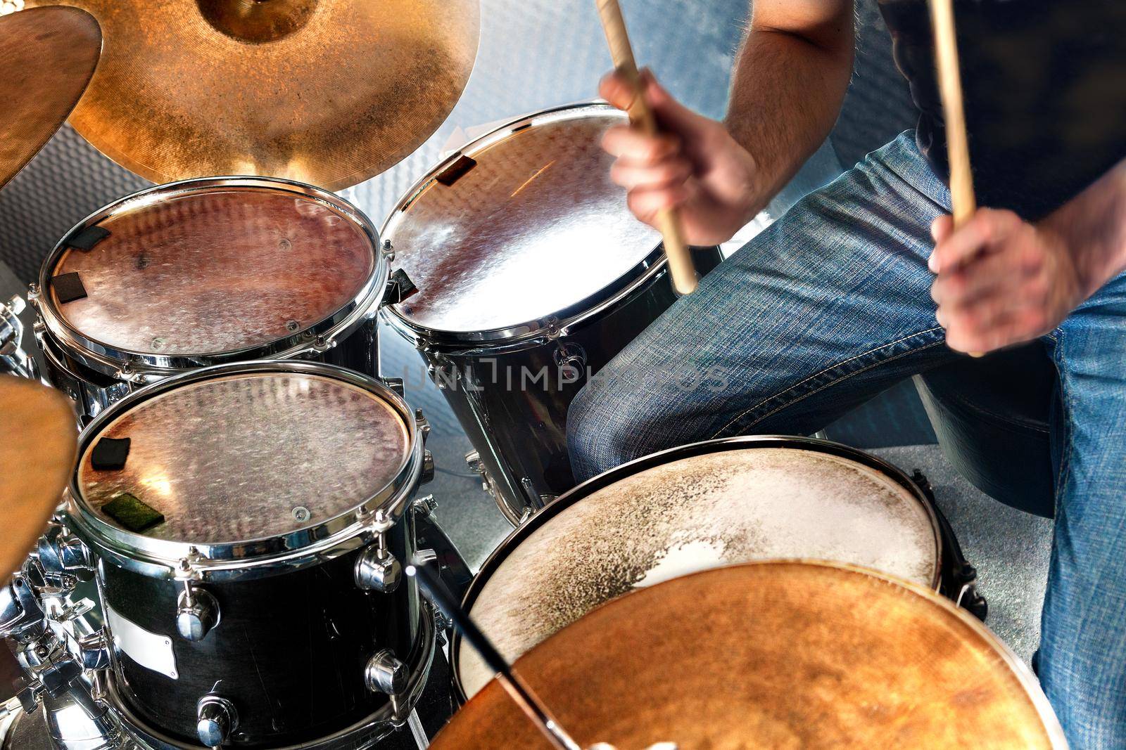 Drummer playing the drumset.Music and entertainment concept.Percussion sound recording in studio