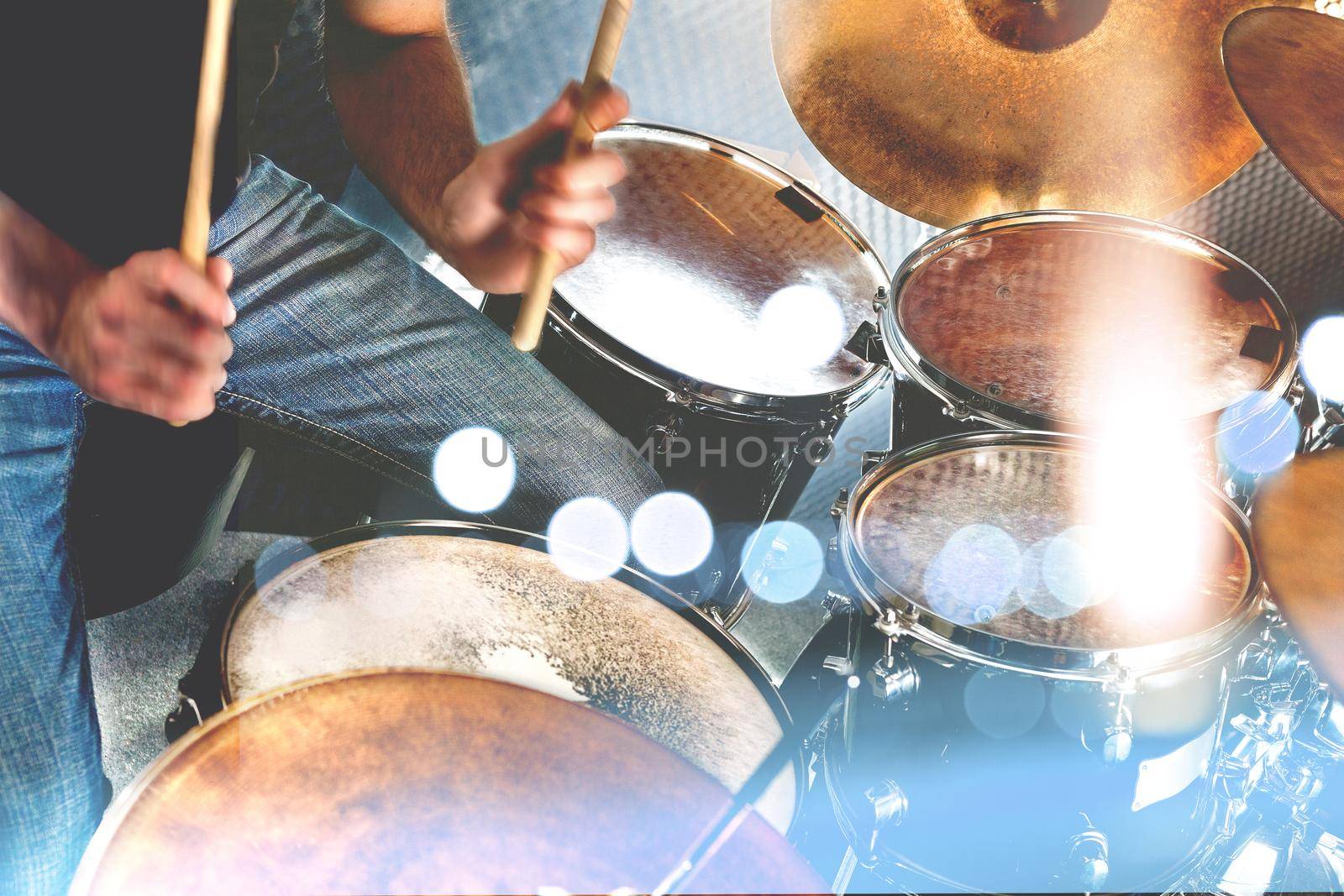 Drummer playing the drumset.Music and entertainment concept.Percussion sound recording in studio