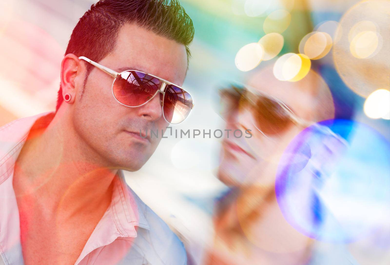 Fashion man portrait in the city and lights lens  flare.