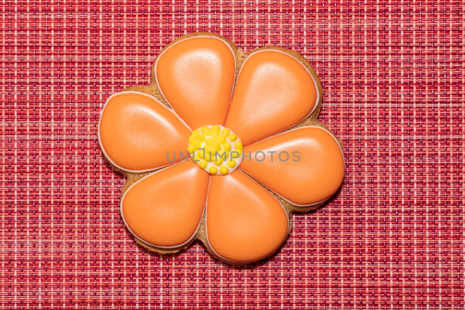 ginger cookies in the form of a flower on a red background. High quality photo
