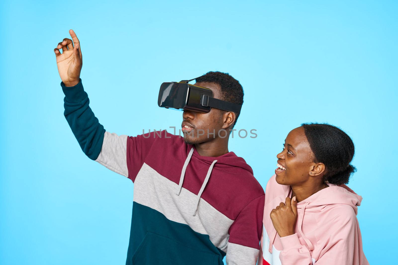 3D virtual reality glasses on the face of an African man and woman by SHOTPRIME