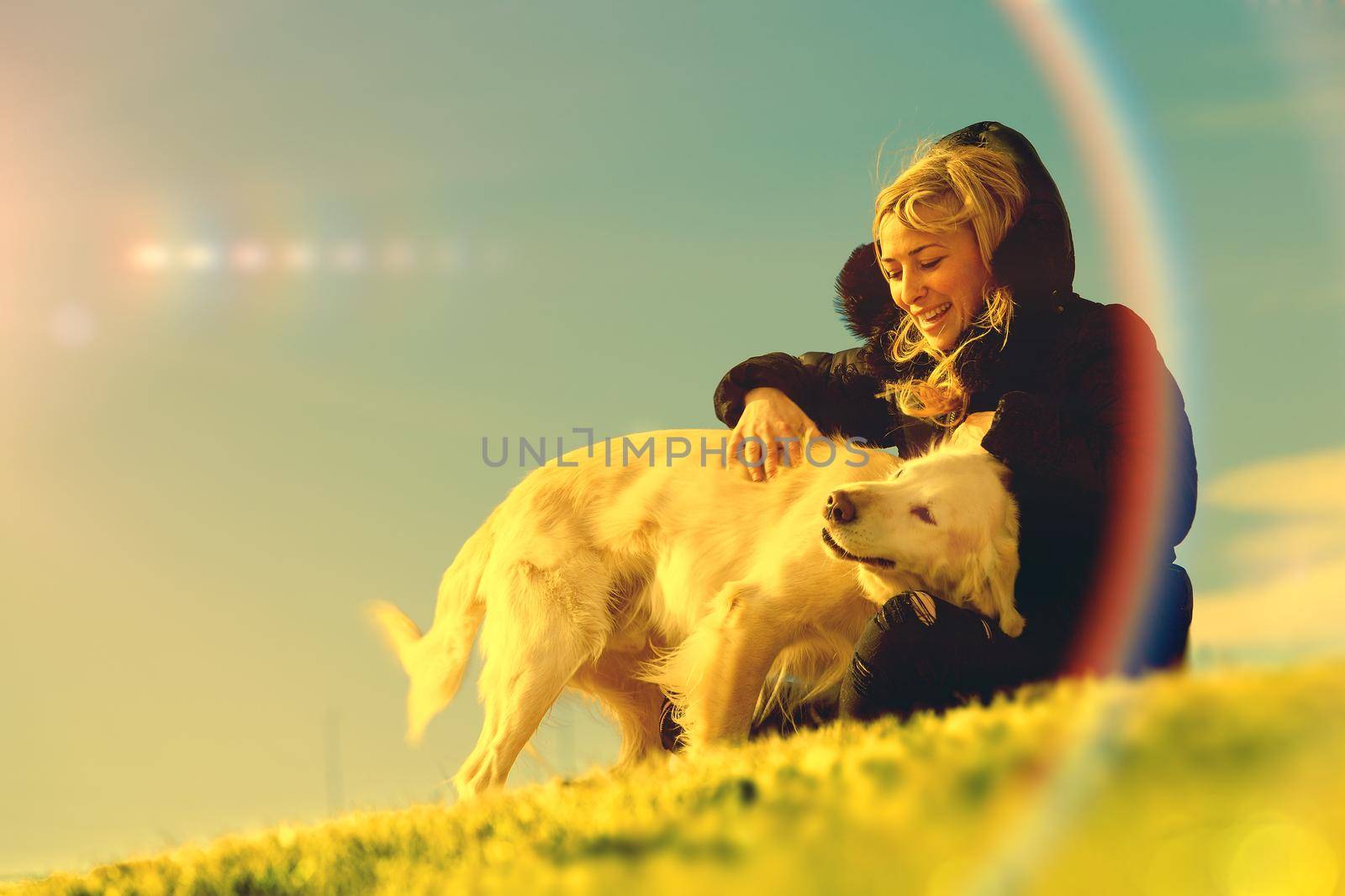 Woman and dogs portrait playing in the park.Companion pets concept