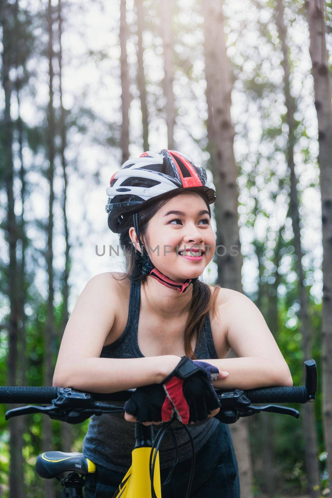 Beautiful young female woman helmet activity bicycle by Sorapop
