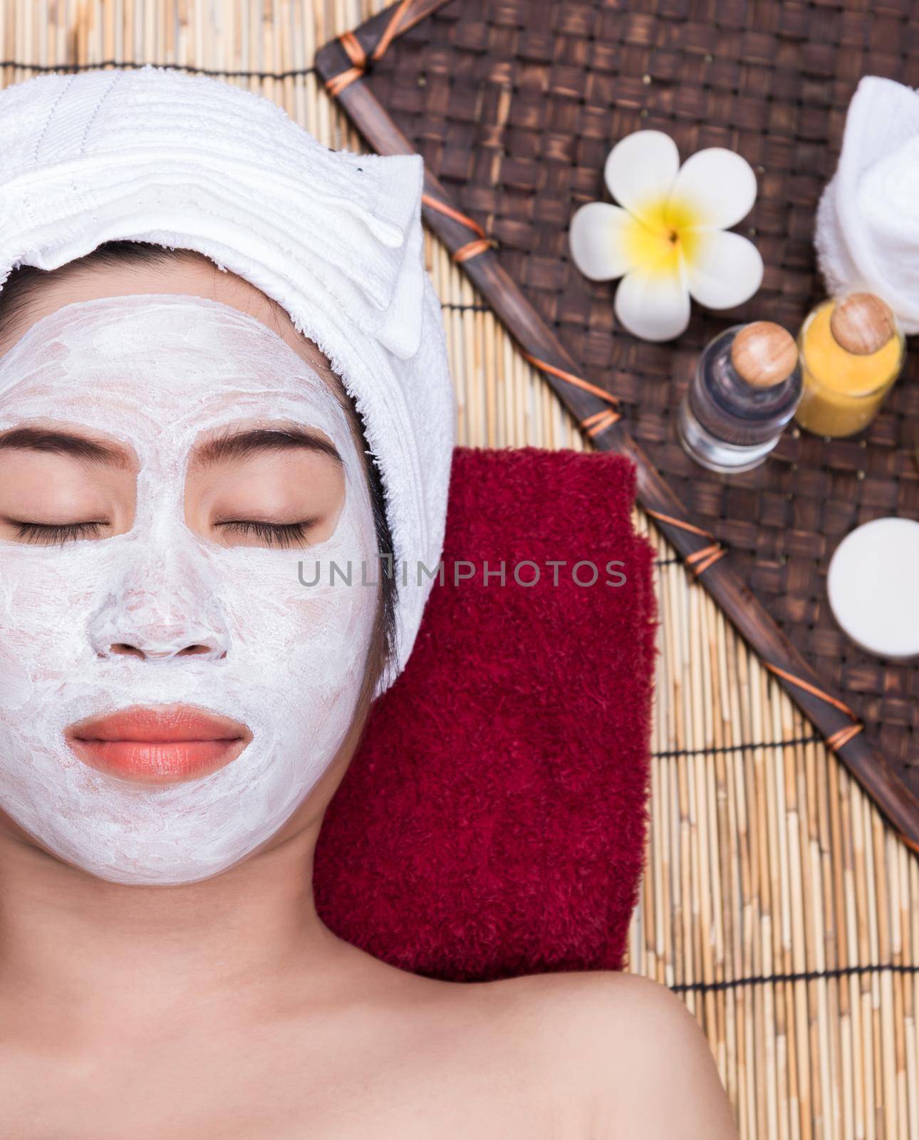 Woman in Treatment Spa Facial Mask by Sorapop