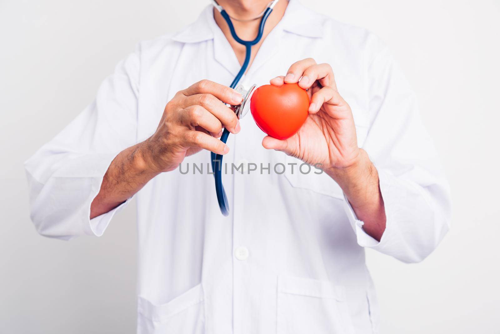 Close up Man doctor with stethoscope he is holding red heart on hand isolate on white background