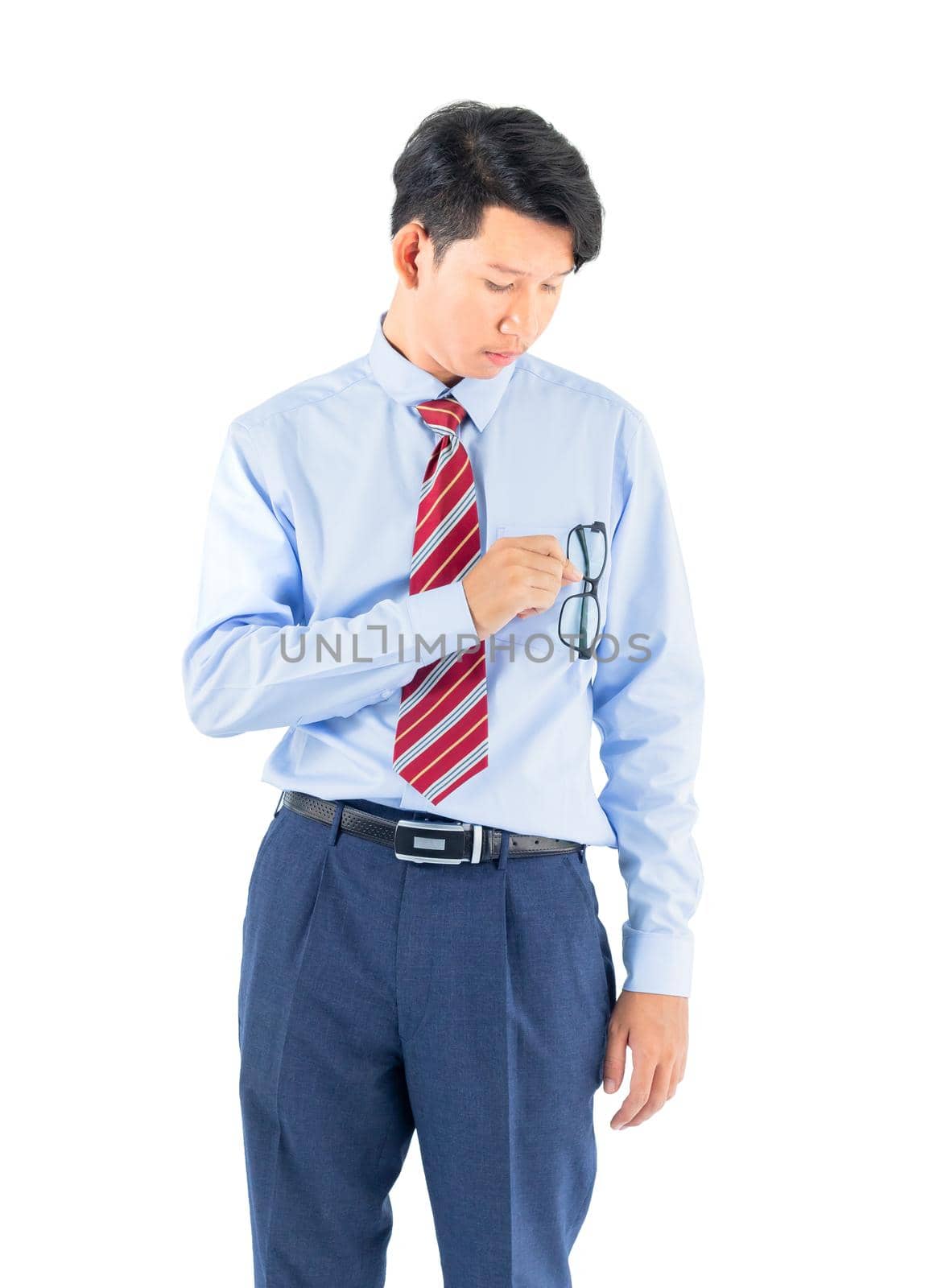 Male wearing blue shirt and red tie reaching posing in studio isolated on white background with clipping path