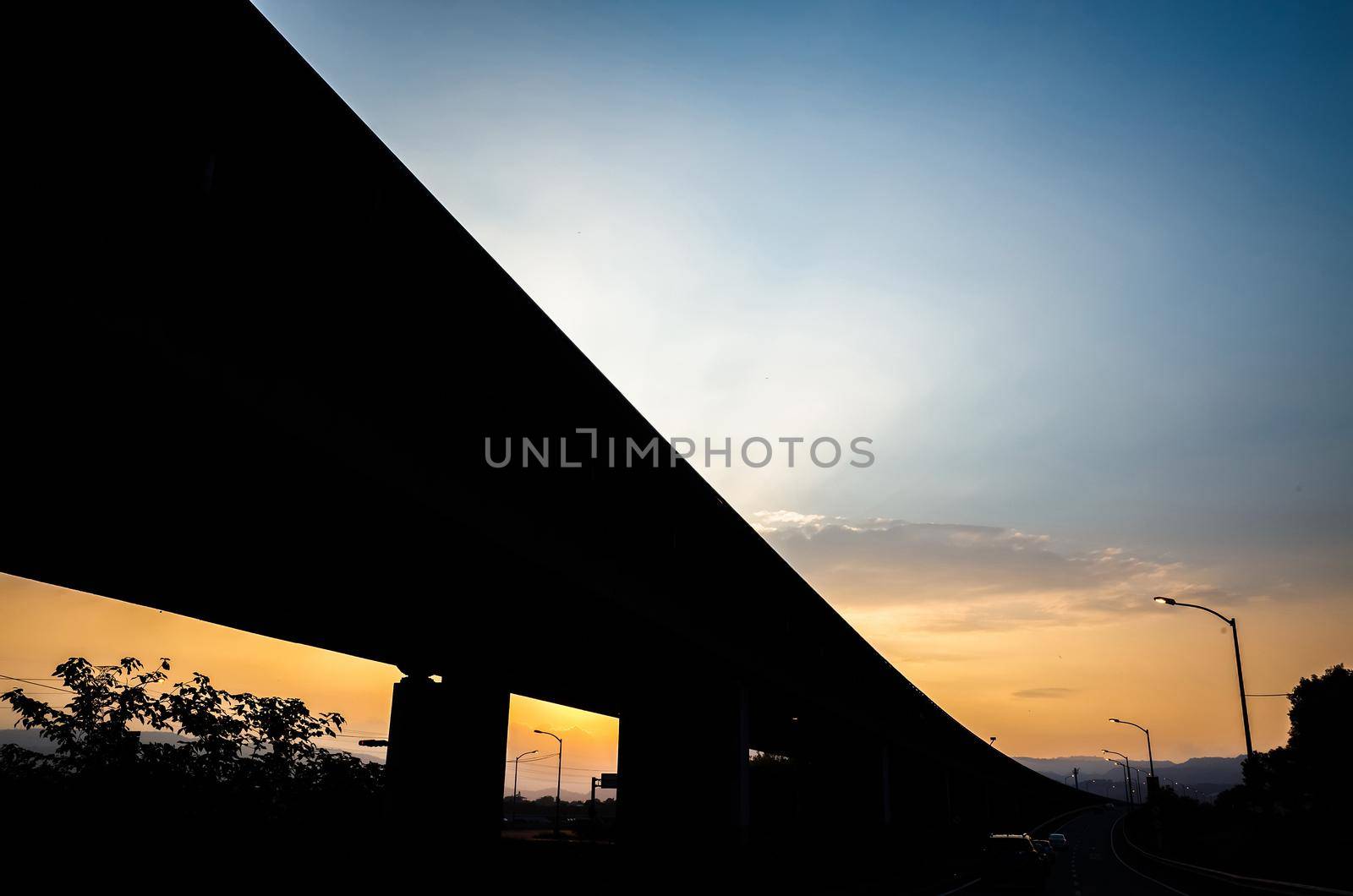 sunset scenery of highway bridge silhouette in the city