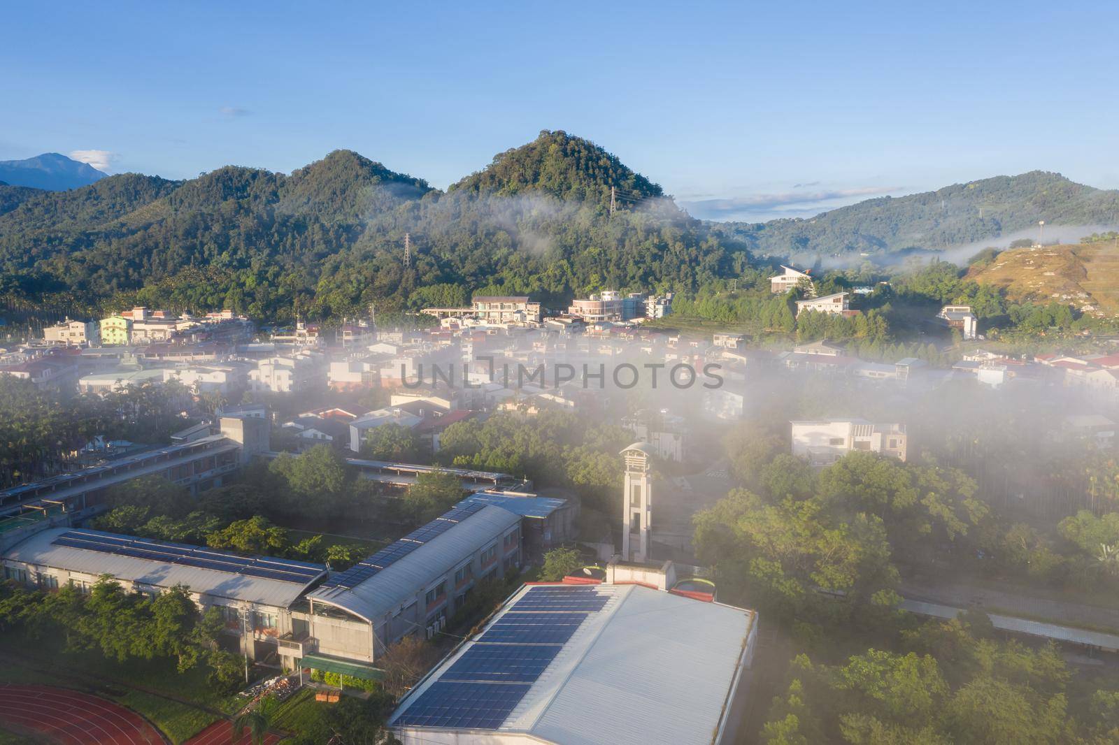 morning cloudy landscape with buildings under clouds and mist in Yuchi township, Nantou, Taiwan