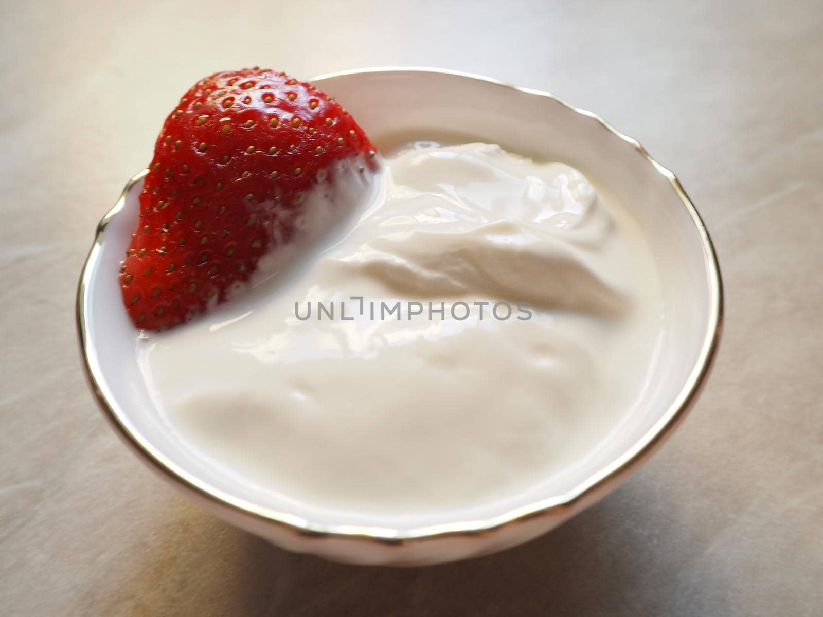 Strawberries in sour cream. Ripe strawberry berry with strawberries. Delicious delicacy. High quality photo