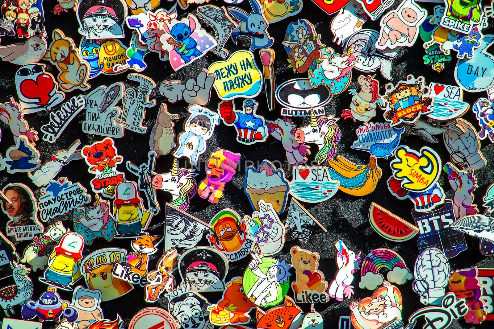 Badges on clothes. Background. Sunny summer day. Top view. Crimea, Sudak - 10 October 2020. by Essffes