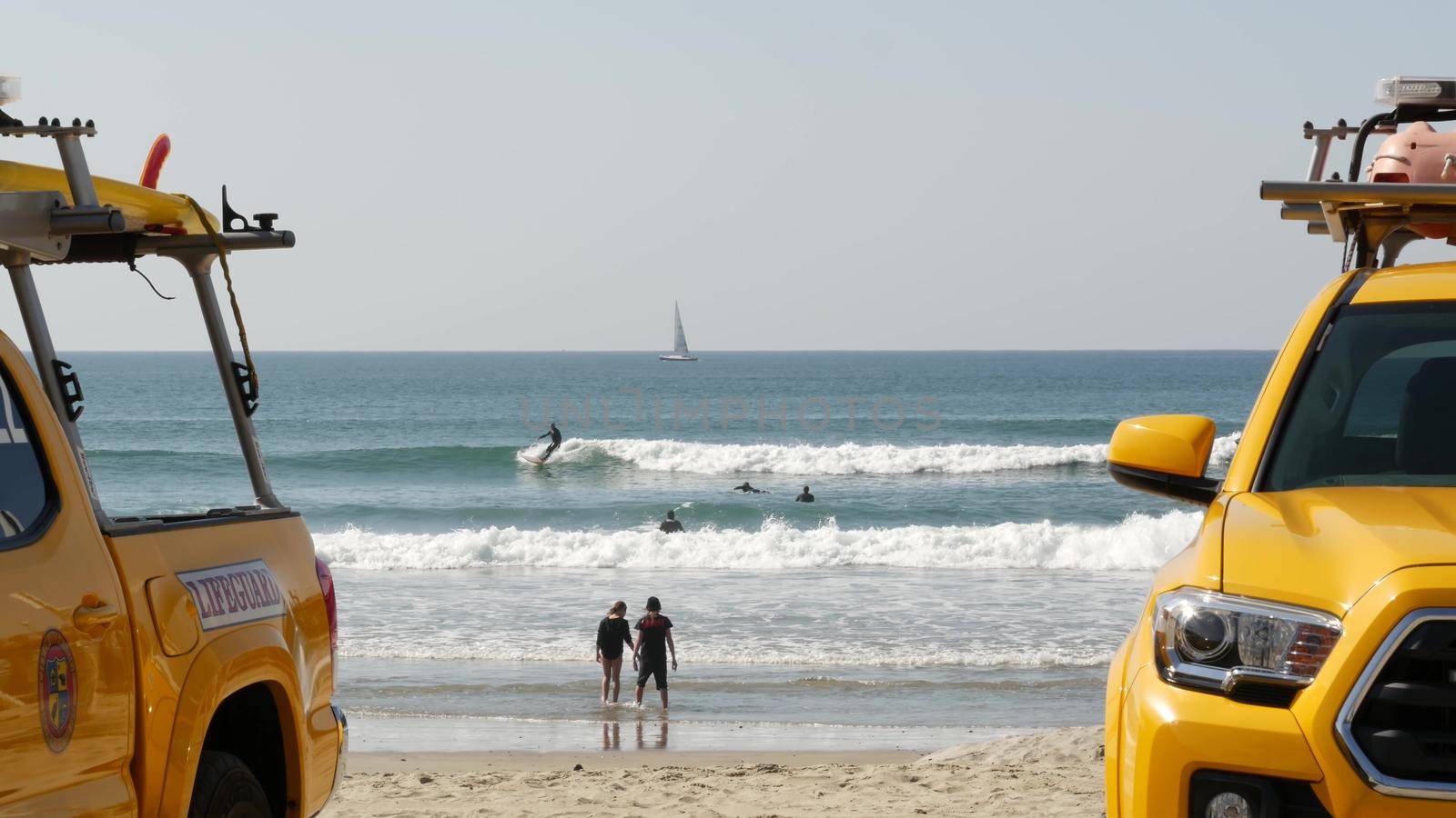 Yellow lifeguard car, beach near Los Angeles. Rescue Toyota pick up truck, lifesavers California USA by DogoraSun