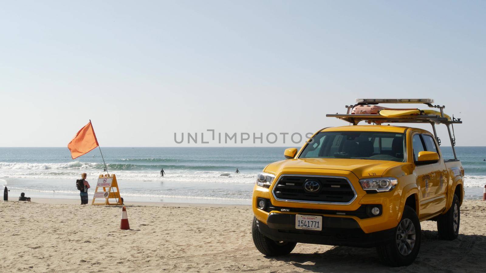 Yellow lifeguard car, beach near Los Angeles. Rescue Toyota pick up truck, lifesavers California USA by DogoraSun