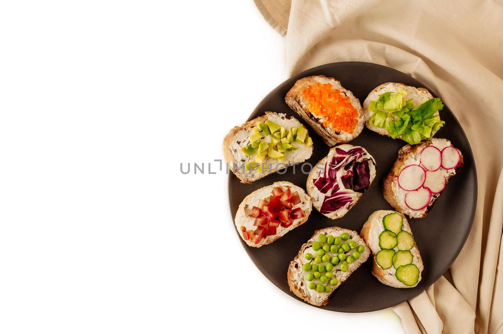 Mini sandwich set with french baguette, cheese, fish and avocado on white background top view mock up. copy space to the left by Alla_Morozova93