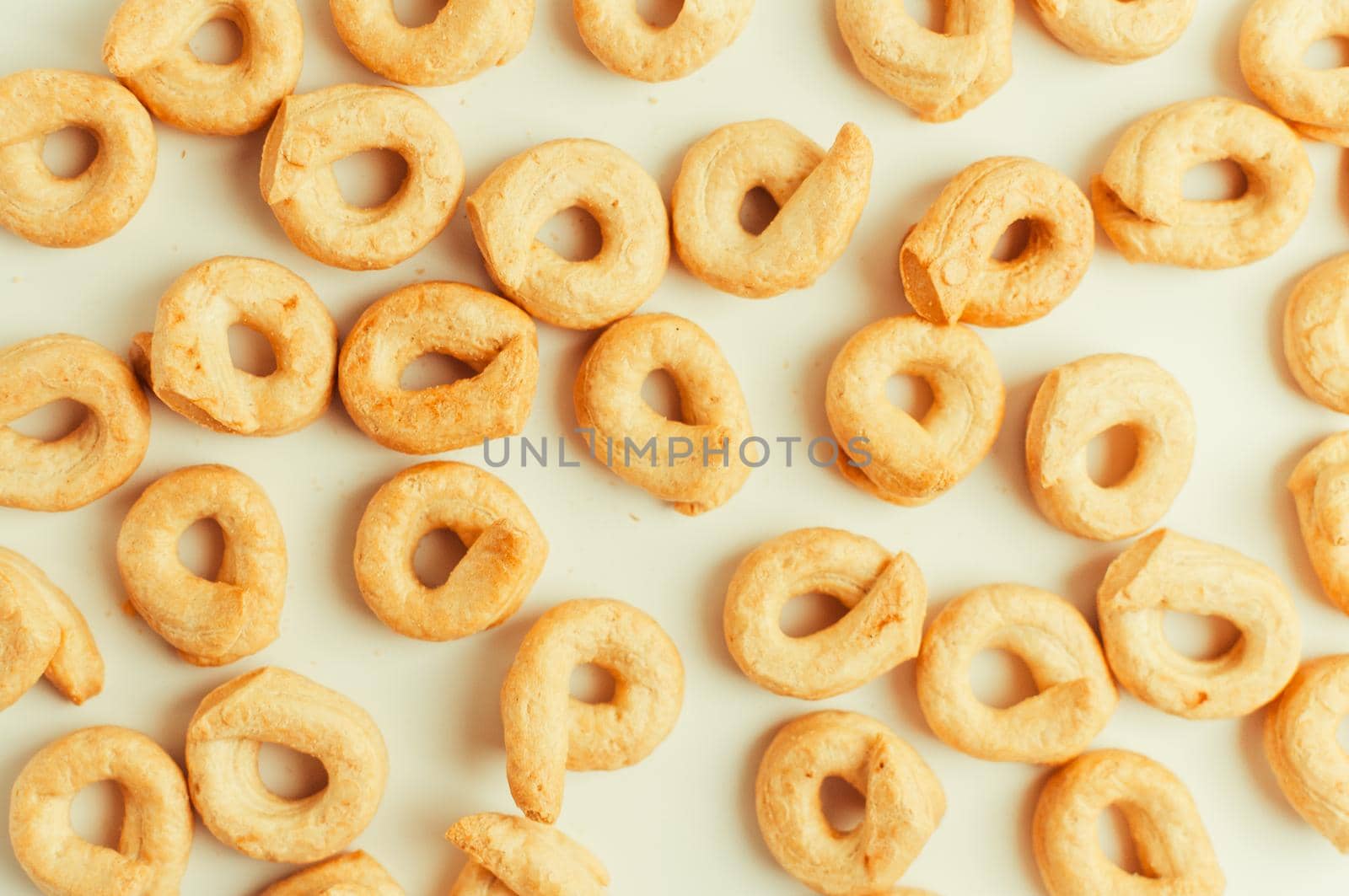 Taralli - a traditional Italian snack similar to drying or bagels, typical for the cuisine of Sicily and Calabria. Bagel on a white background, isolate pattern. Copy space.