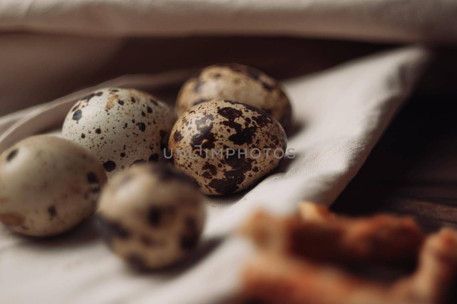 quail eggs lie on a linen tablecloth. Selective focus. Preparing for the Easter holiday.