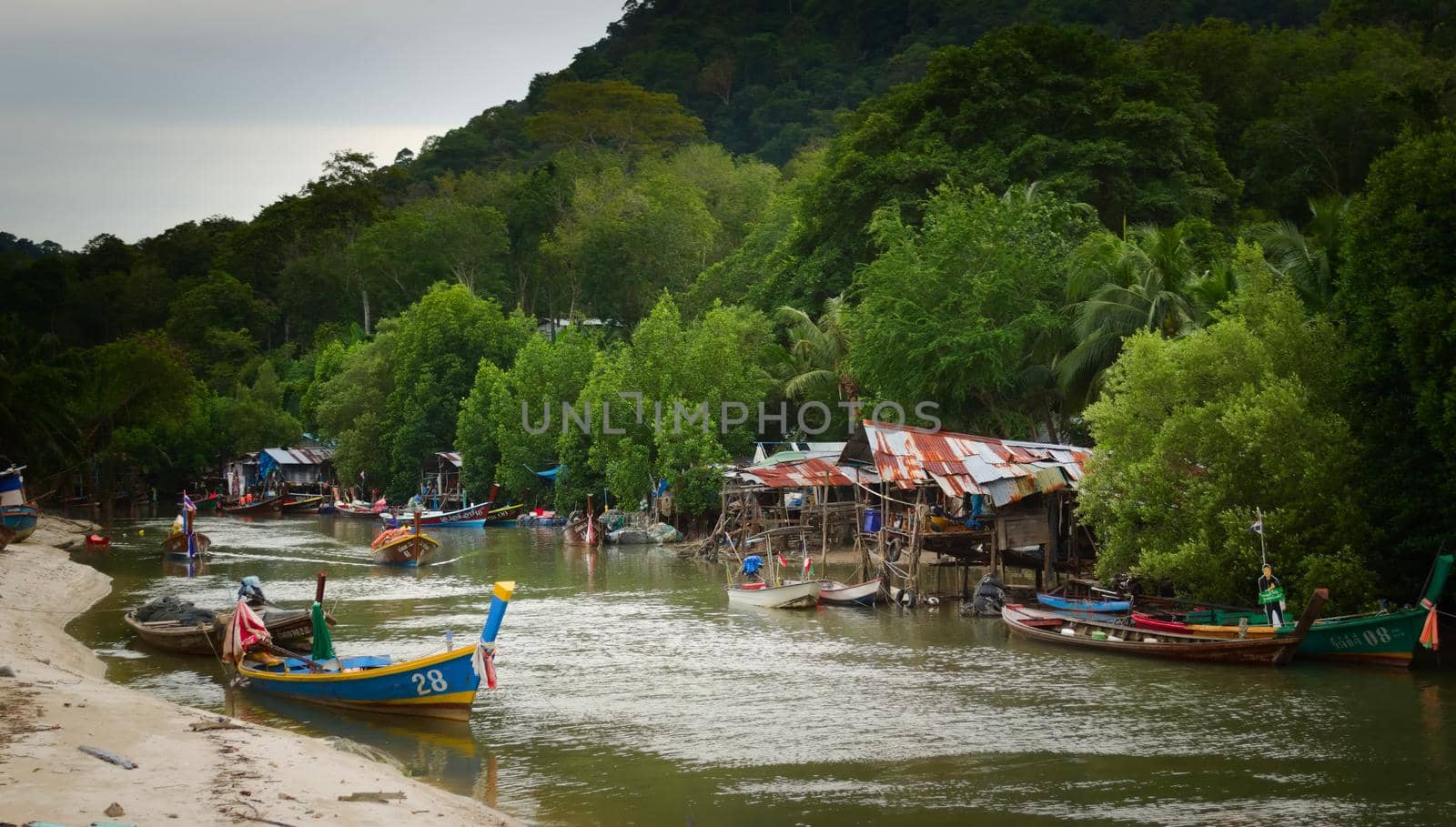 2019-11-05 / Phuket, Thailand - Wooden shacks by the river in a poverty stricken area of the town. by hernan_hyper