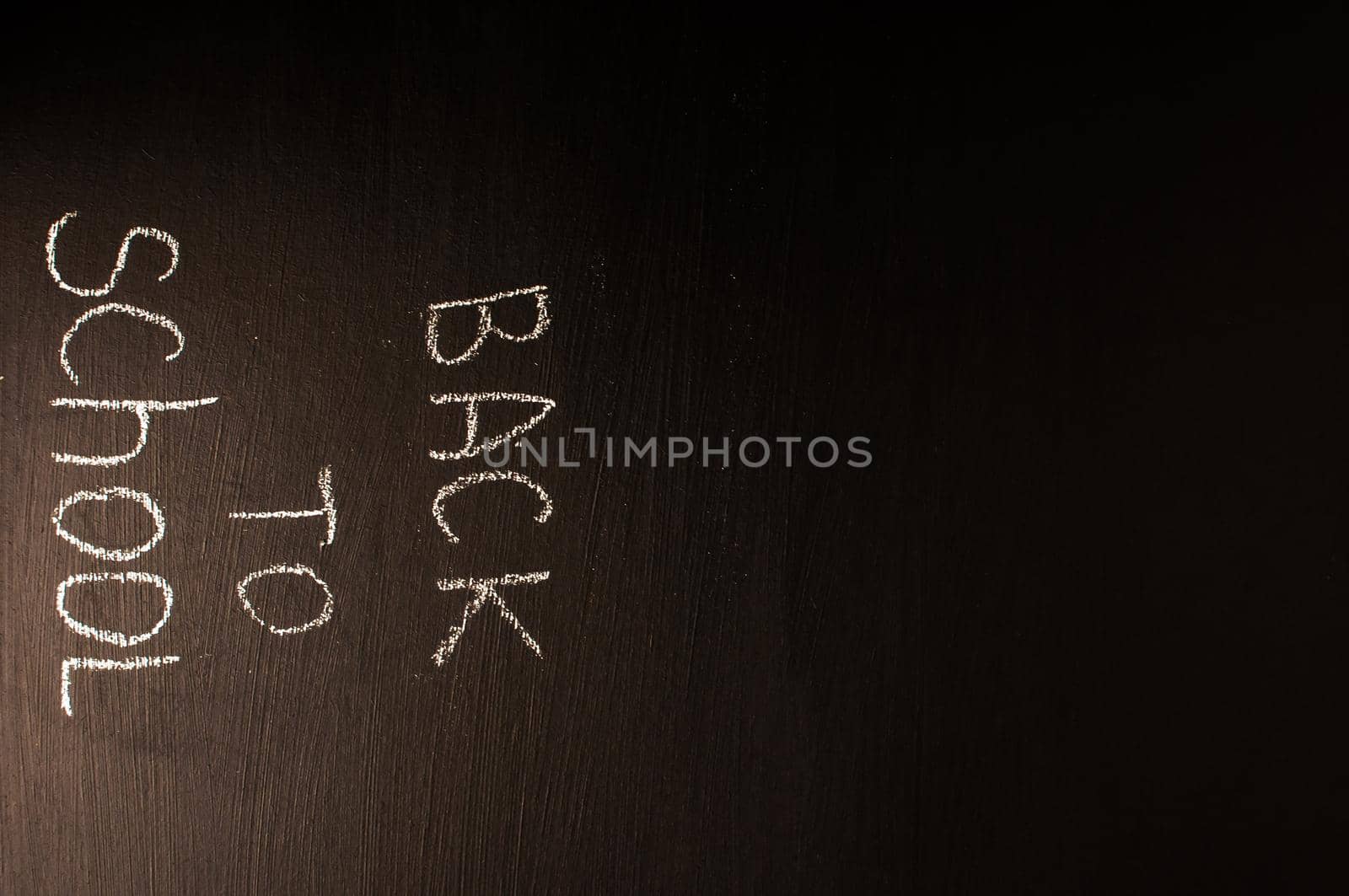 Back to school, the concept of parenting. The inscription on the blackboard with white chalk. Place for text. Copy space.