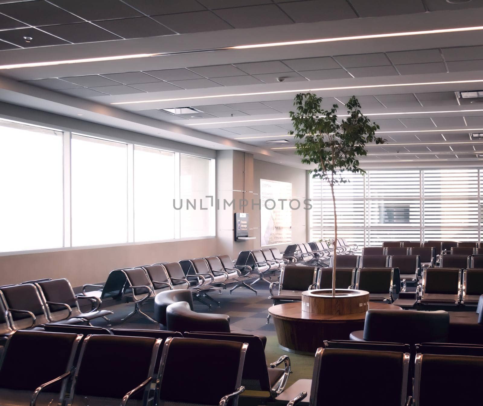 Empty seats at the waiting area of an airport. by hernan_hyper