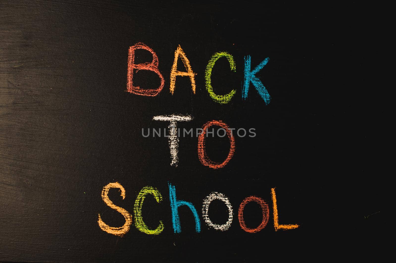 Back to school, the concept of parenting. The inscription on the blackboard colored chalk.