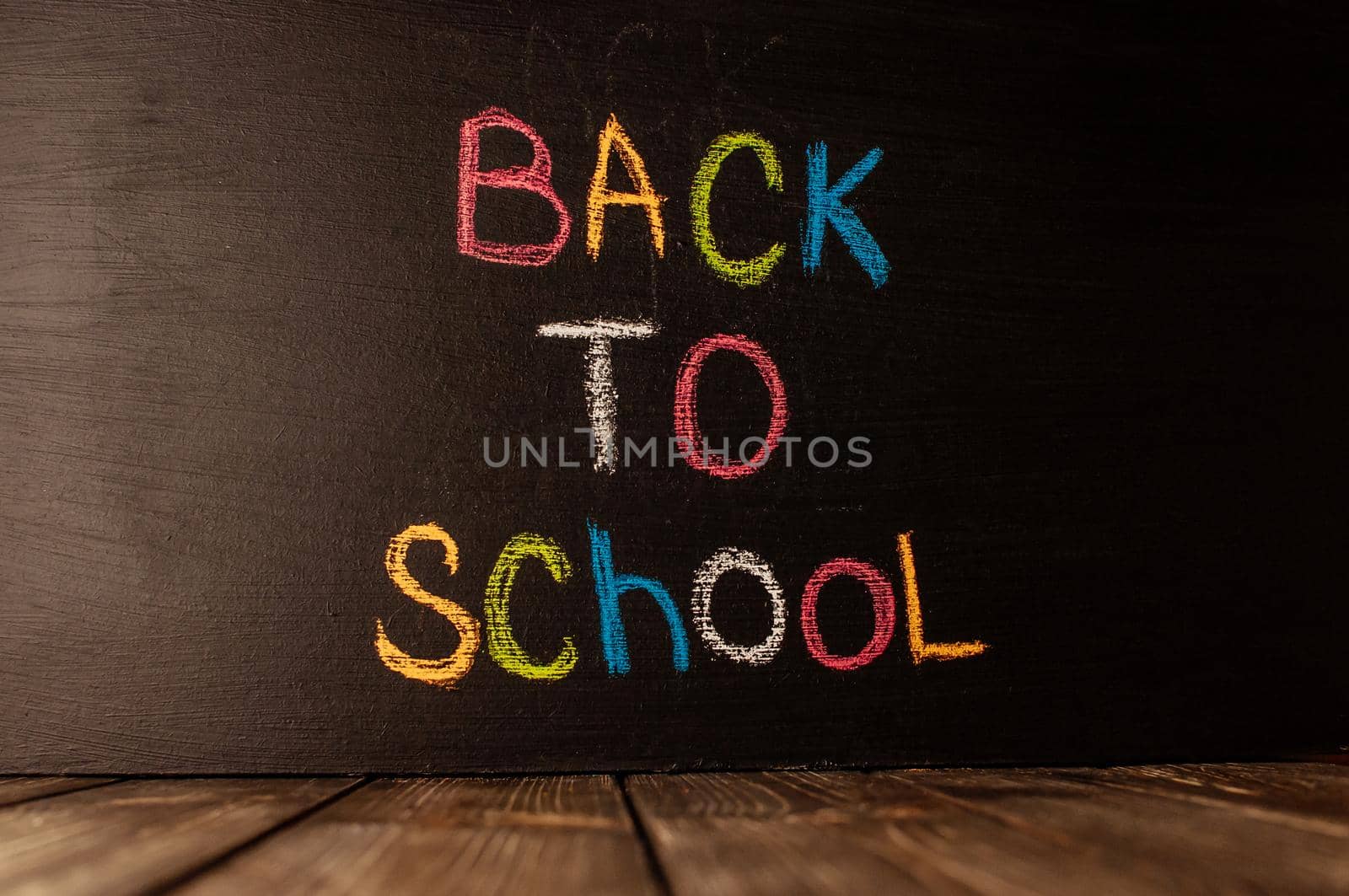 Back to school, the concept of parenting. The inscription on the blackboard colored chalk.