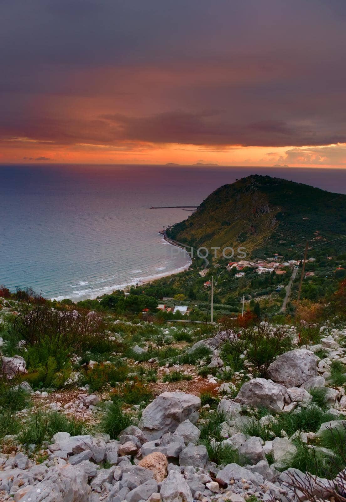 Elevated view of the coast near Terracina, Italy, at sunset. by hernan_hyper