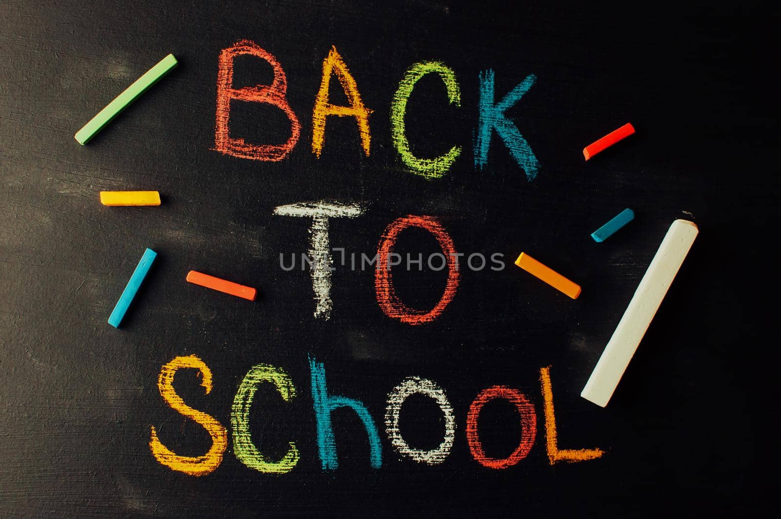 Back to school, the concept of parenting. The inscription on the blackboard colored chalk.