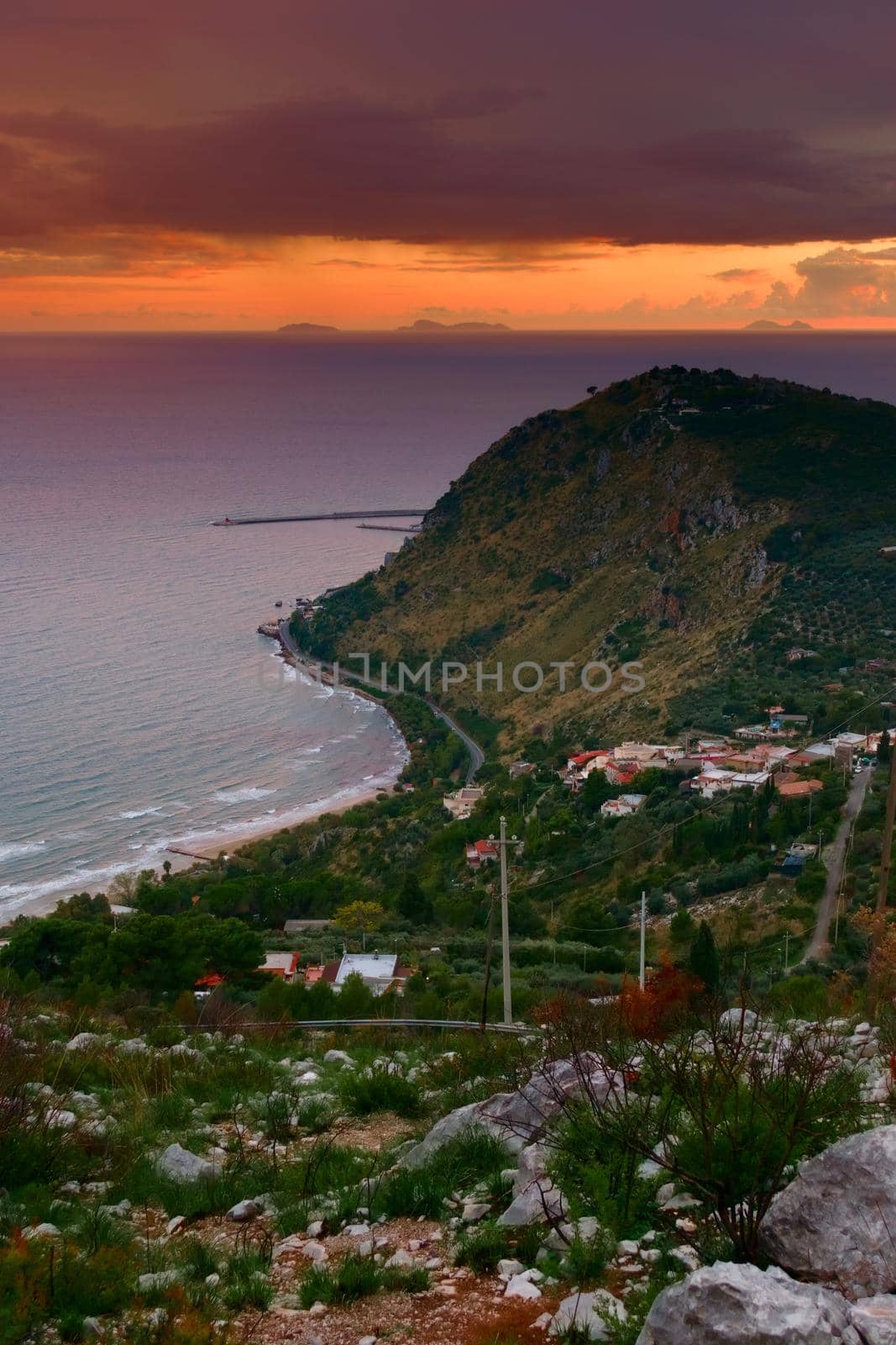 Elevated view of the coast near Terracina, Italy, at sunset. by hernan_hyper