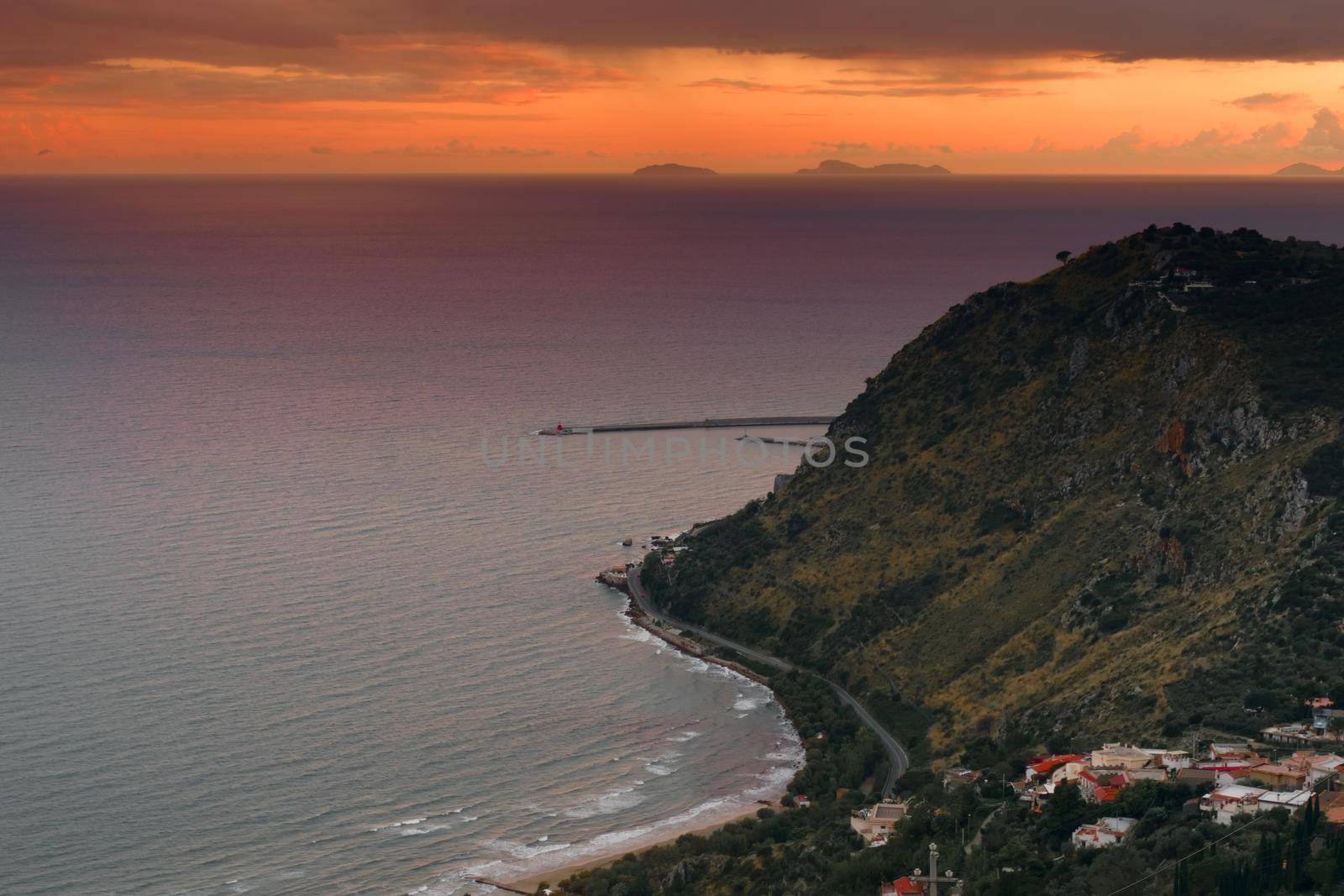 Elevated view of the coast near Terracina, Italy, at sunset. by hernan_hyper