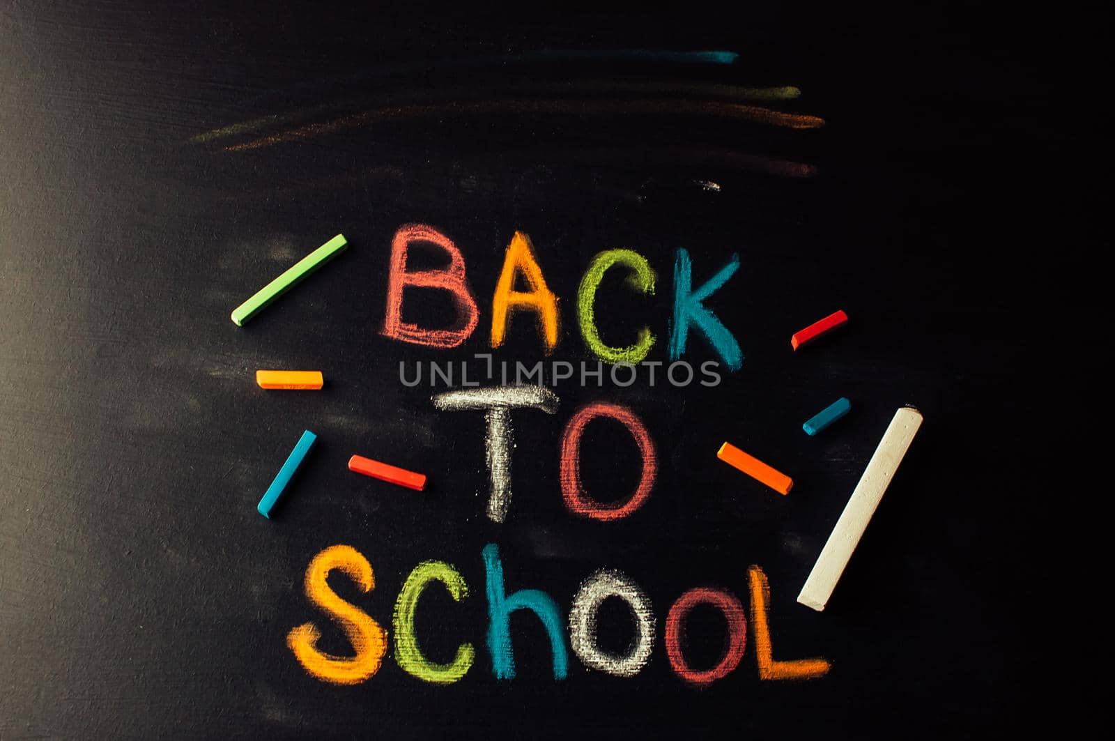 Back to school, the concept of parenting. The inscription on the blackboard colored chalk.