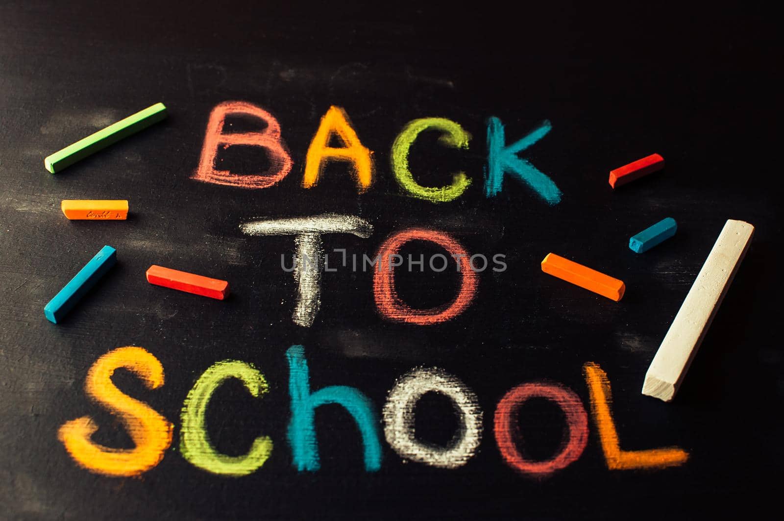 Back to school, the concept of parenting. The inscription on the blackboard colored chalk.