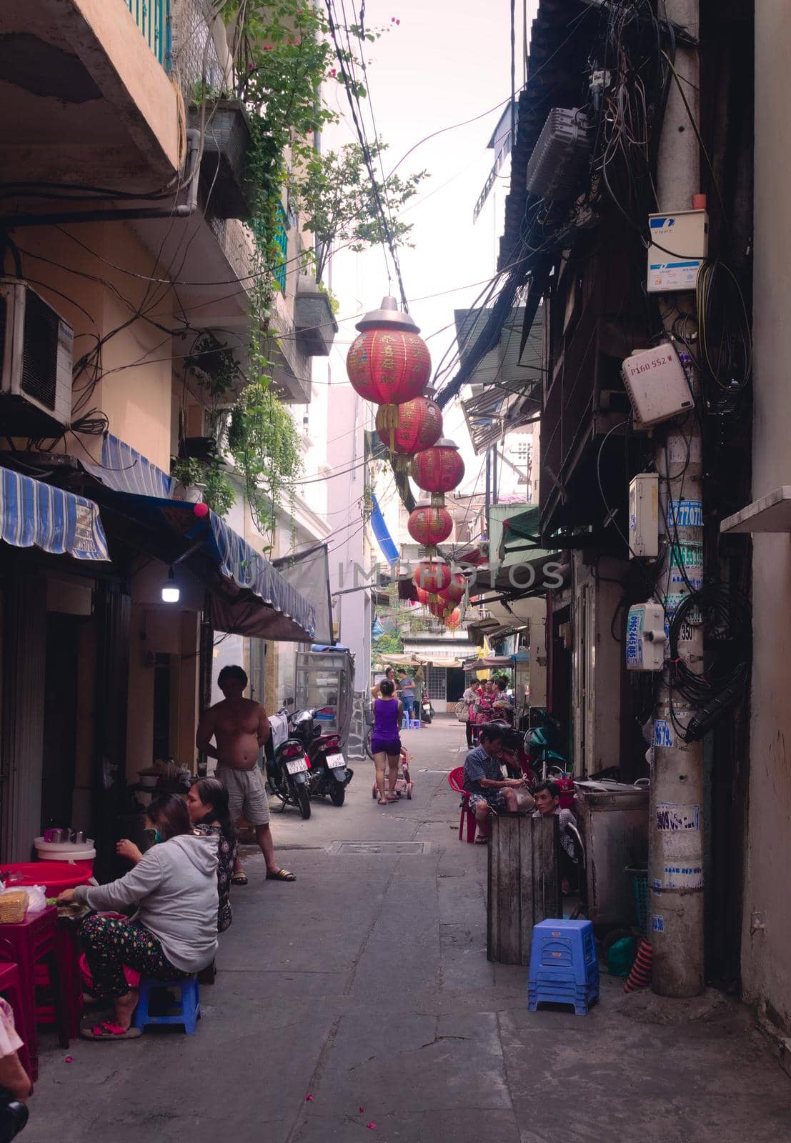 2019-11-10 / Ho Chi Minh City, Vietnam - Everyday life scene. Narrow back alley in a poor area of the city.