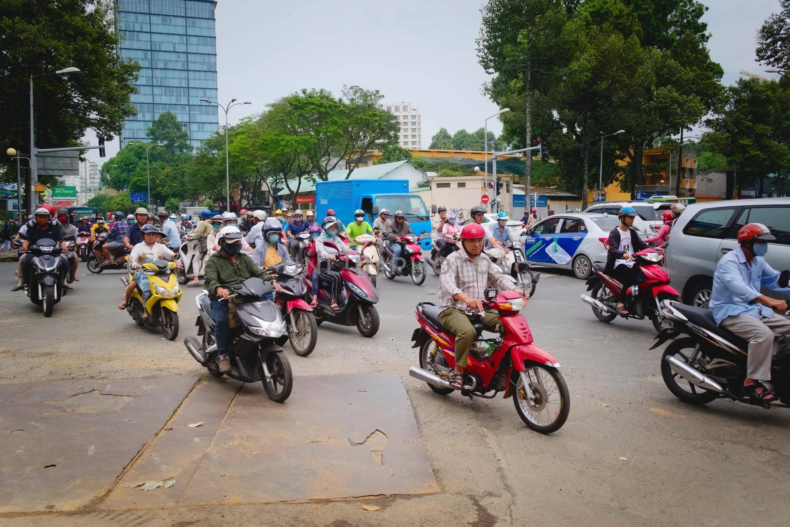 2019-11-10 / Ho Chi Minh City, Vietnam - Urban scene in rush hour. Motorcycles flood the chaotic traffic flow of the city.