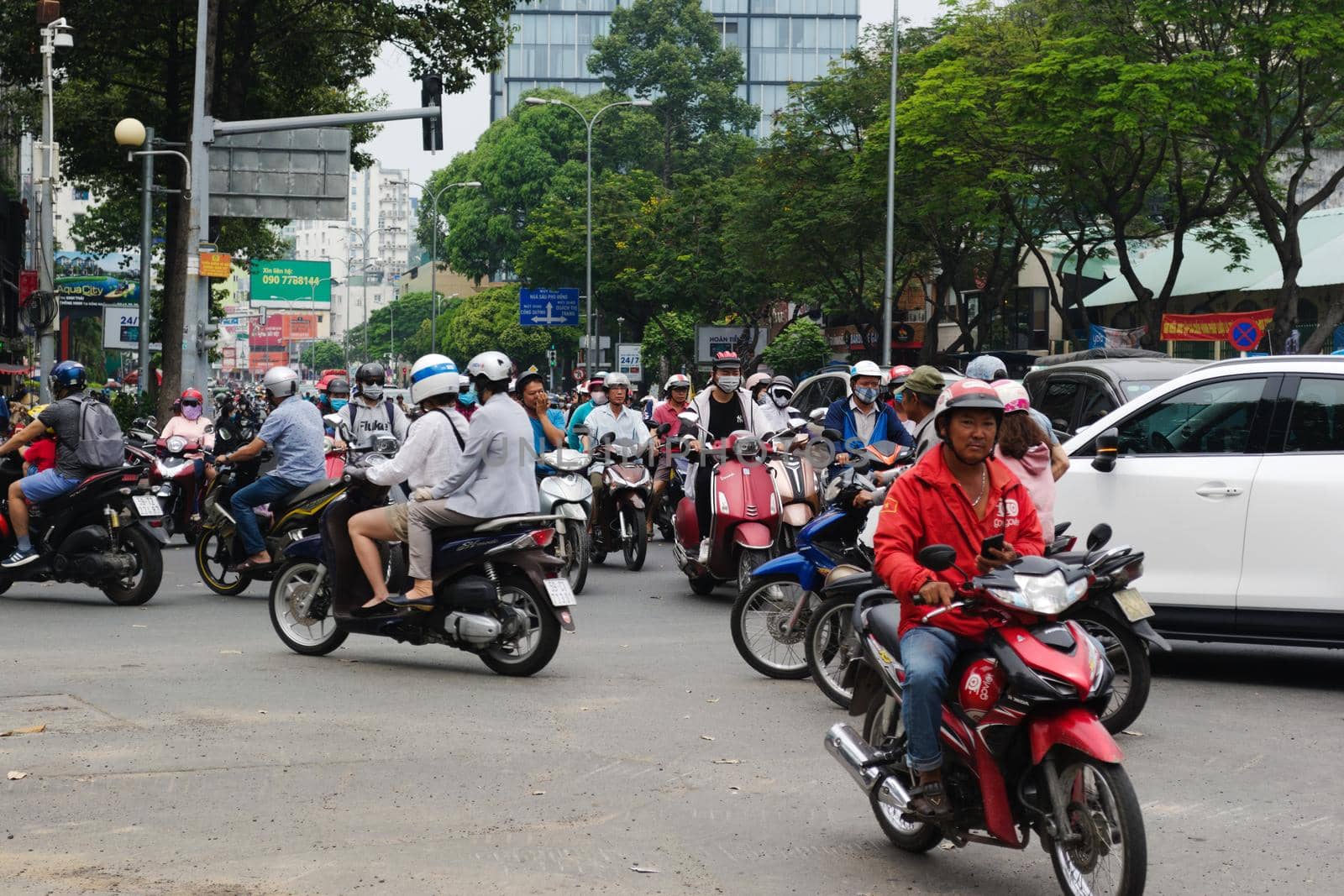 2019-11-10 / Ho Chi Minh City, Vietnam - Urban scene in rush hour. Motorcycles flood the chaotic traffic flow of the city.