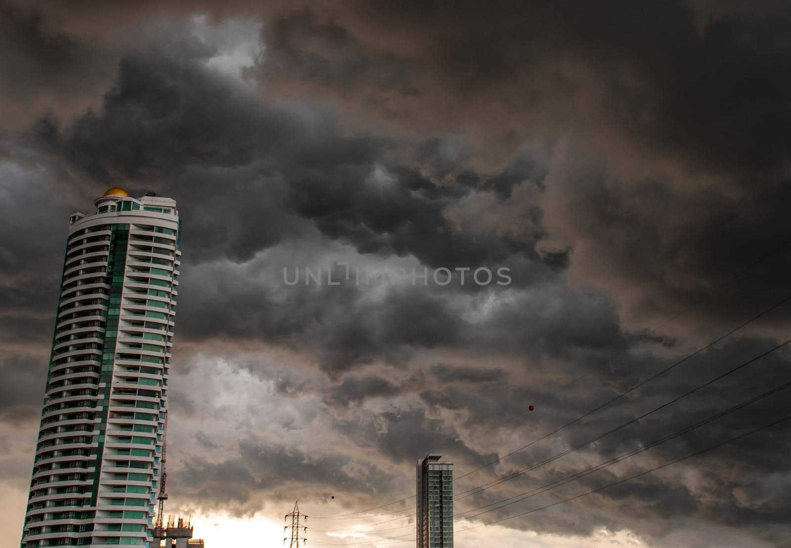 Bangkok, Thailand - 21 Jul 2019 : Beautiful clouds and sky with sun rays over the city, before heavy rain, Landscape of building in the city