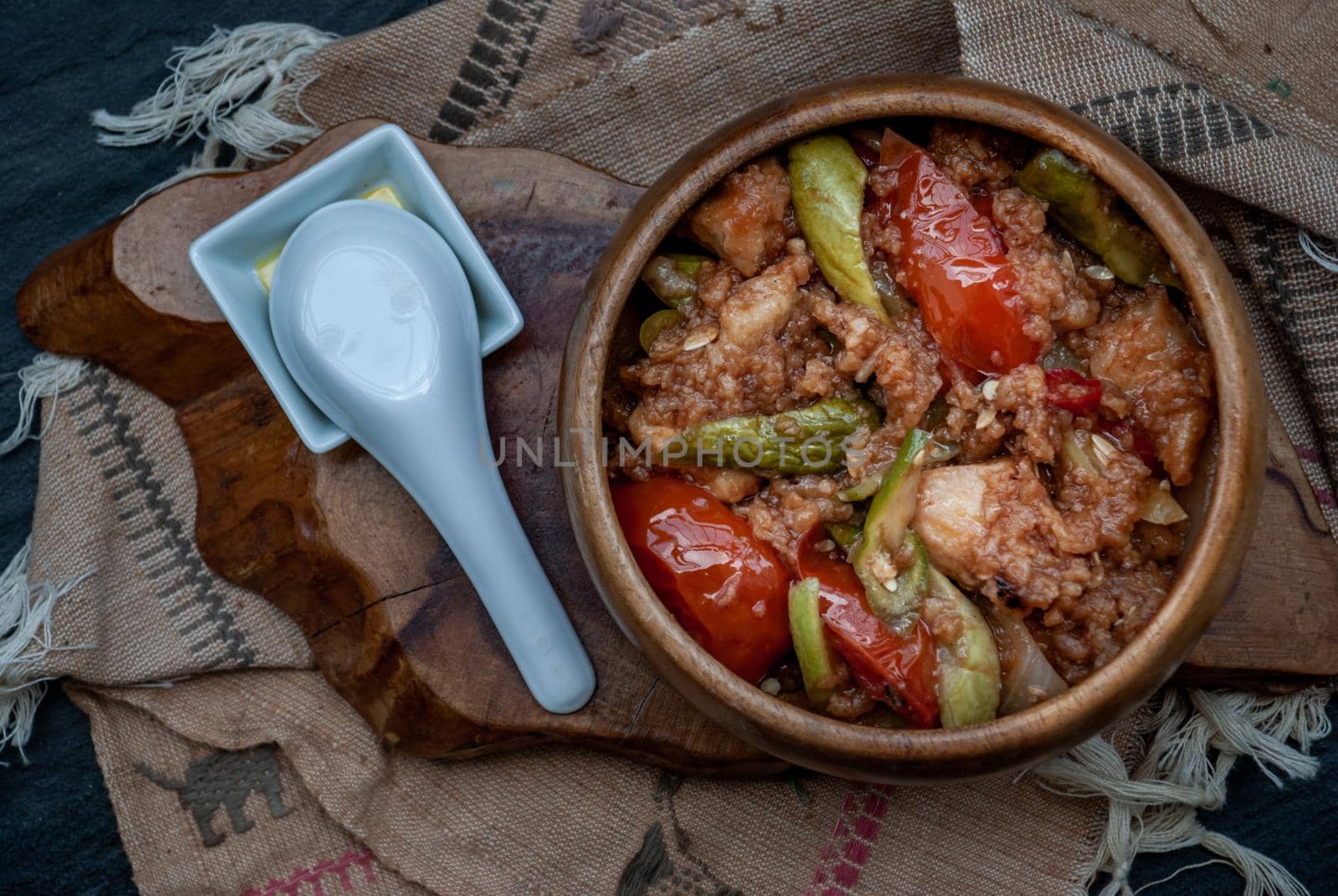 Chinese Cuisine - Fish deep Fried in Sour-Sweet Sauce in wooden bowl. Top view.