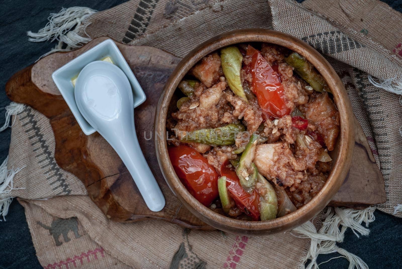 Chinese Cuisine - Fish deep Fried in Sour-Sweet Sauce in wooden bowl. Top view.