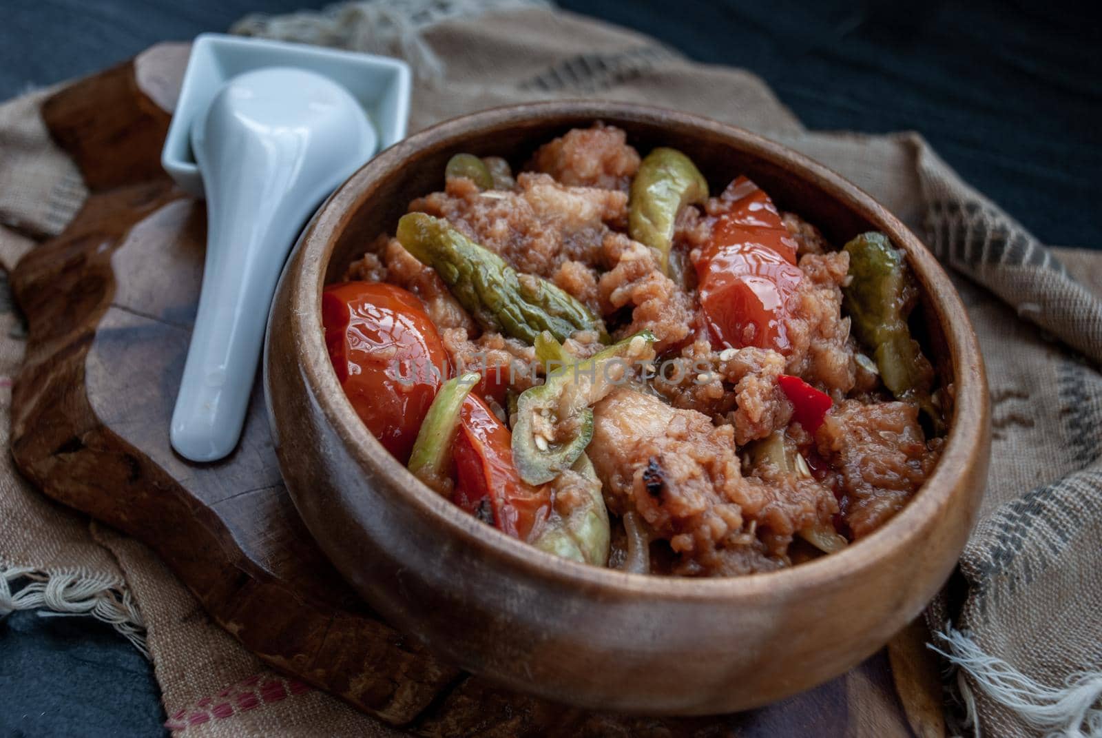 Chinese Cuisine - Fish deep Fried in Sour-Sweet Sauce in wooden bowl. Oblique view from the top.