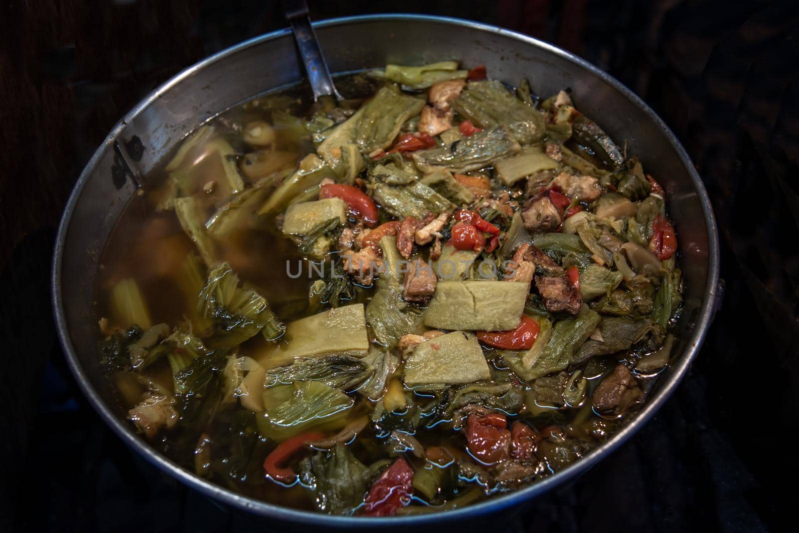 Bitter gourd and pickle mustard with pork spare rib soup. Chinese style. Oblique view from the top, Selective focus.