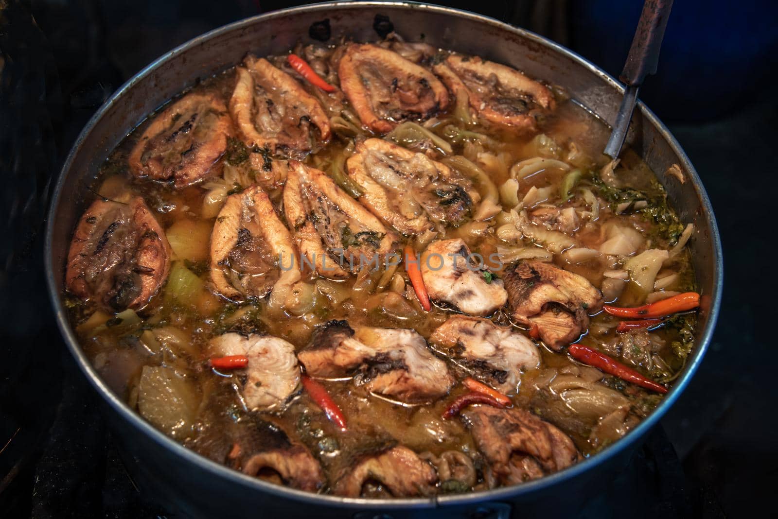 Snake head fish belly with pickle mustard soup. Chinese style. Oblique view from the top, Selective focus.