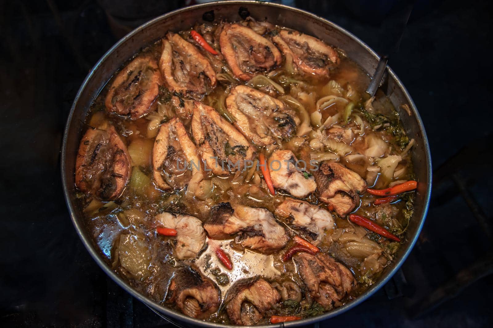 Snake head fish belly with pickle mustard soup. Chinese style. Oblique view from the top, Selective focus.