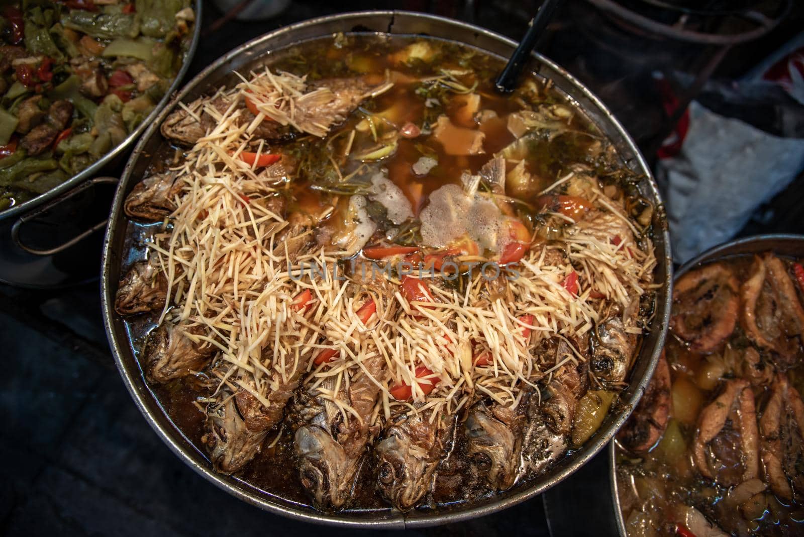 Silver fish with sour pickles mustard and ginger with Chinese style soup. Oblique view from the top, Selective focus.