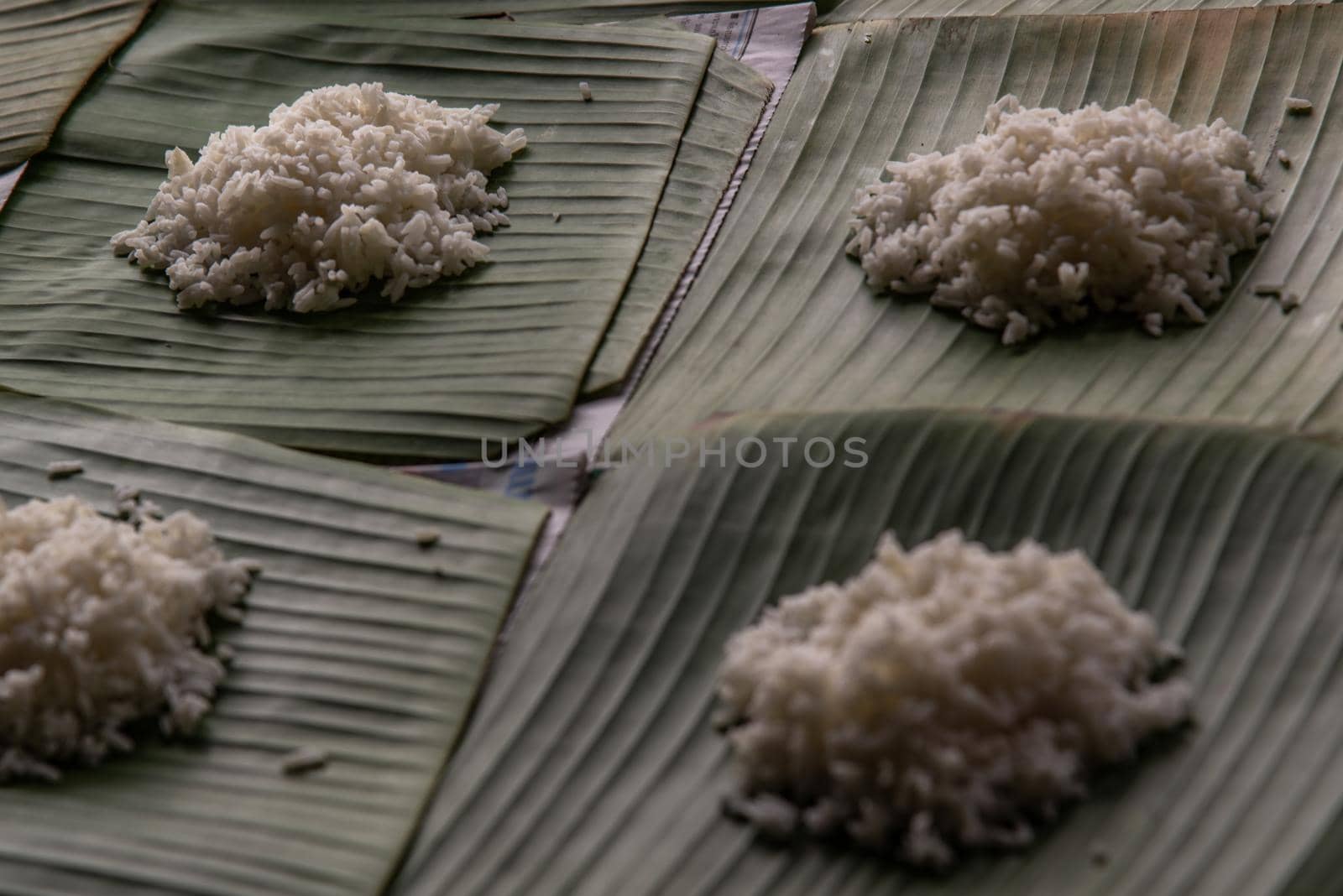 White rice is cooked rice by steaming or boiling on served on a banana leaf in Thai restaurant that is staple food in Thailand, Selective focus.