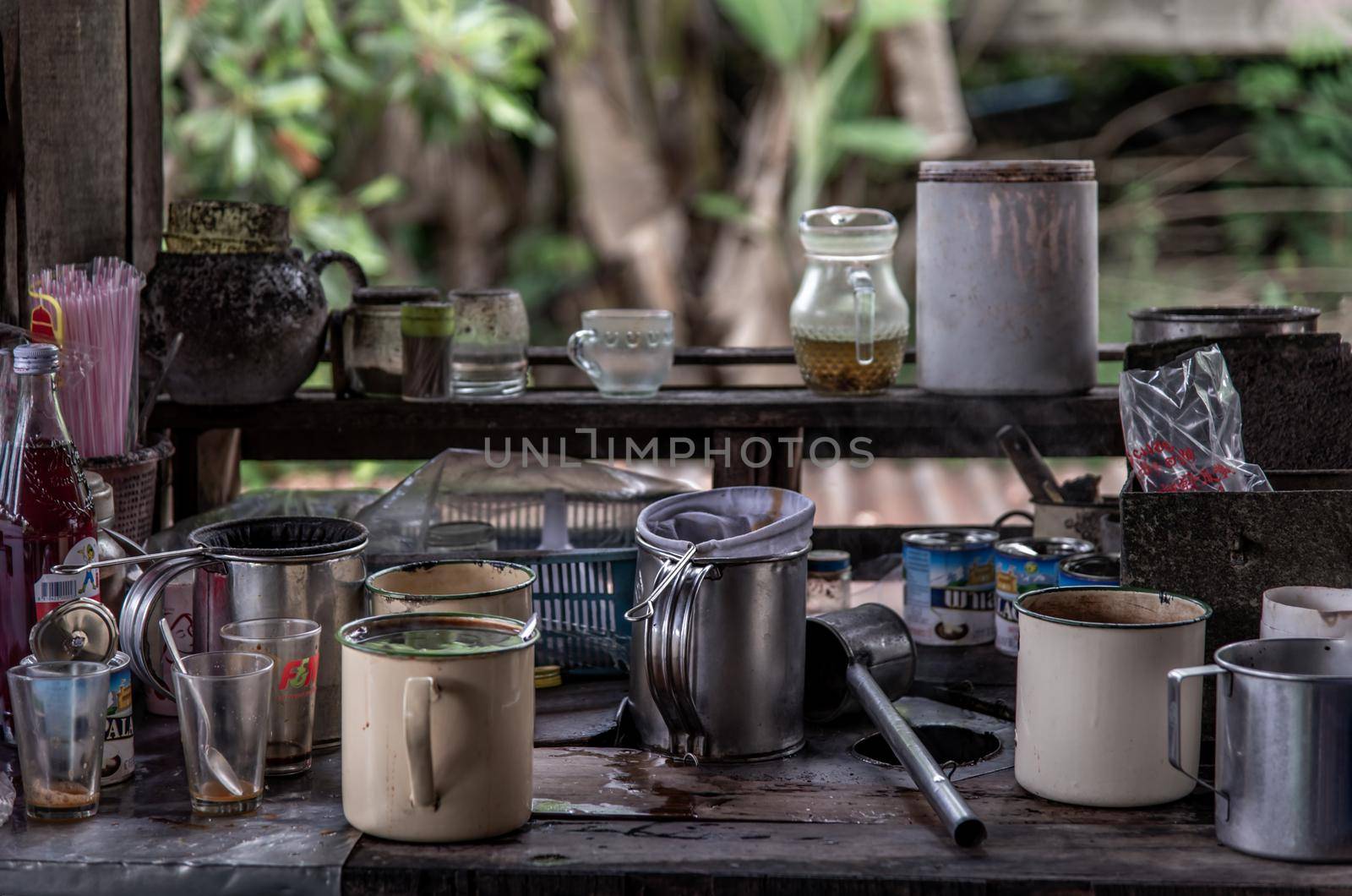 Samut Sakhon, Thailand - Nov 02, 2019 : local cafe -decorated with vintage wooden furniture and antique goods, Making a traditional Thai Coffee and Tea on counter for sale at street food market, vintage style, Selective focus.
