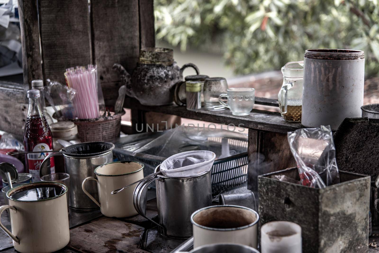 Samut Sakhon, Thailand - Nov 02, 2019 : local cafe -decorated with vintage wooden furniture and antique goods, Making a traditional Thai Coffee and Tea on counter for sale at street food market, vintage style, Selective focus.