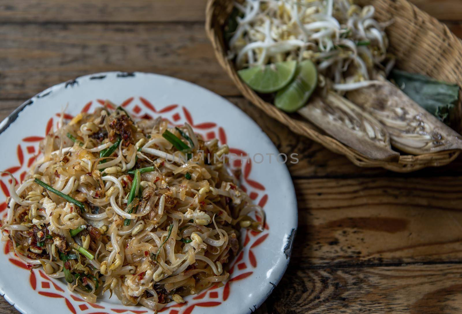 Popular Thai fried local Korat noodle with cube tofu and shrimp, call Pad Mee Korat, Korat Stir fried Rice Noodle, Mee Korat is the name of the local region in Thailand, Selective focus.