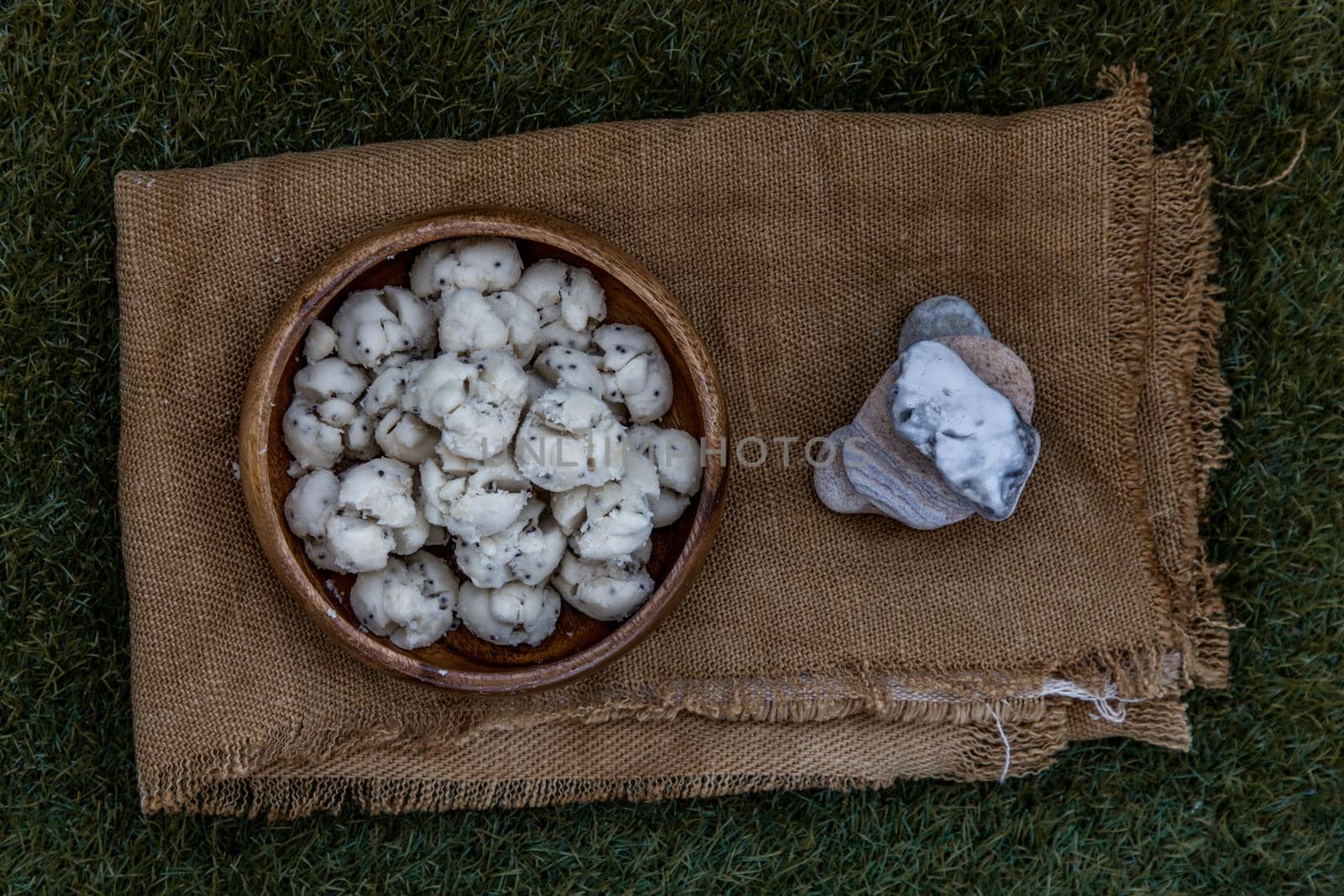Thai Shortbread Cookies (Thai Dessert), Kanom Kleeb Lum Duen on burlap fabric background, view from above, Selective focus.
