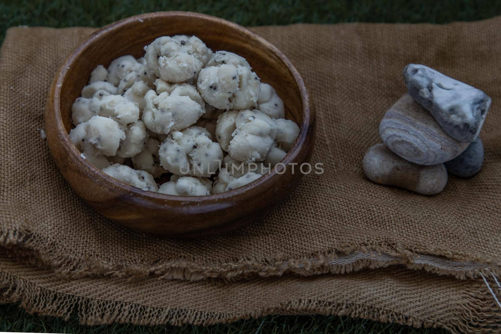 Thai Shortbread Cookies (Thai Dessert), Kanom Kleeb Lum Duen on burlap fabric background, Oblique view from the top, Selective focus.