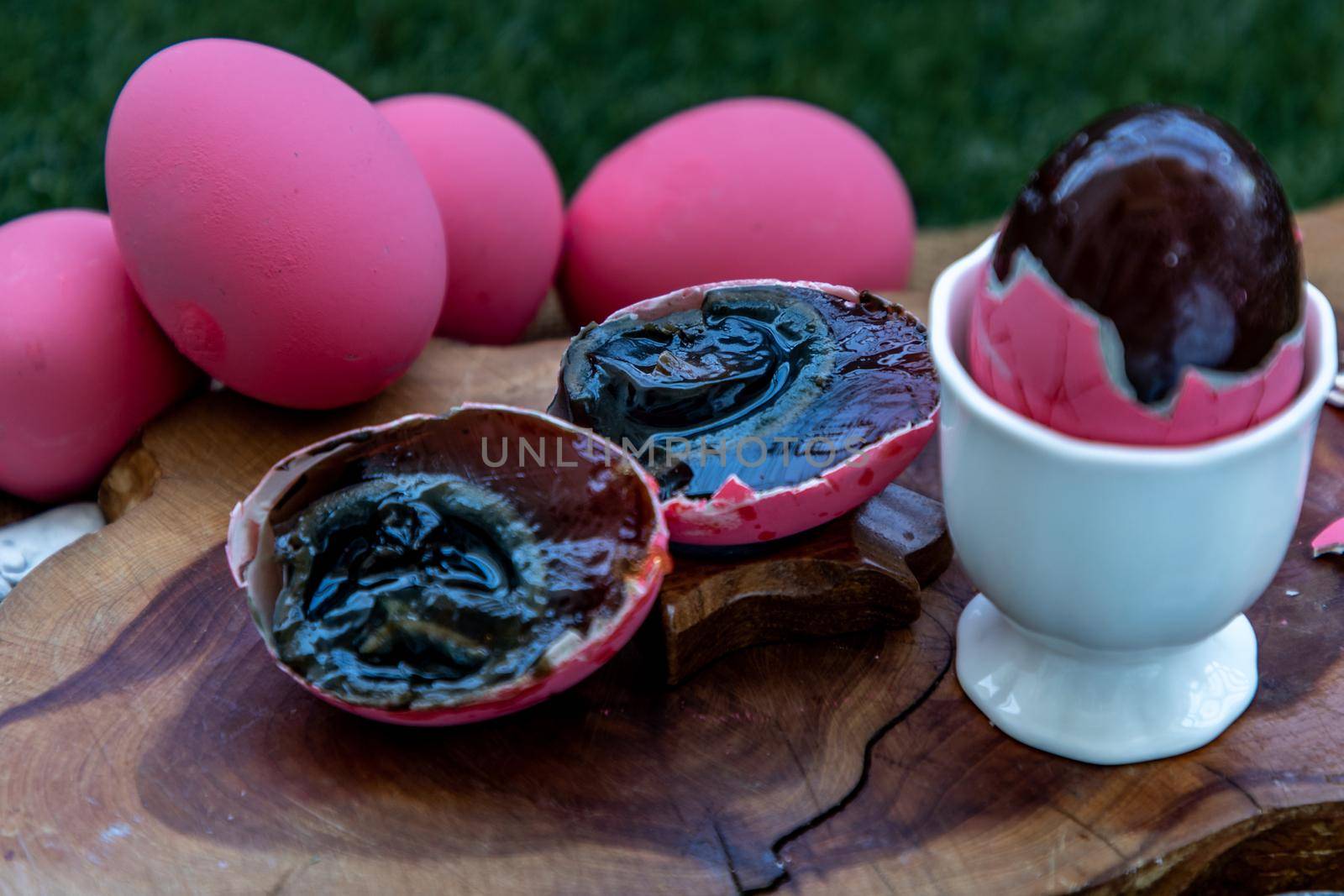 Asian Traditional Food, Pink Century eggs (Pidan Eggs) also known as preserved egg, hundred-year egg, thousand-year egg are a Chinese preserved food product and delicacy made by preserving duck, chicken in A Mixture of Ash, Salt, Red Lime, Sodium Carbonate, Tea Leaves and Zinc Oxide, Selective focus.